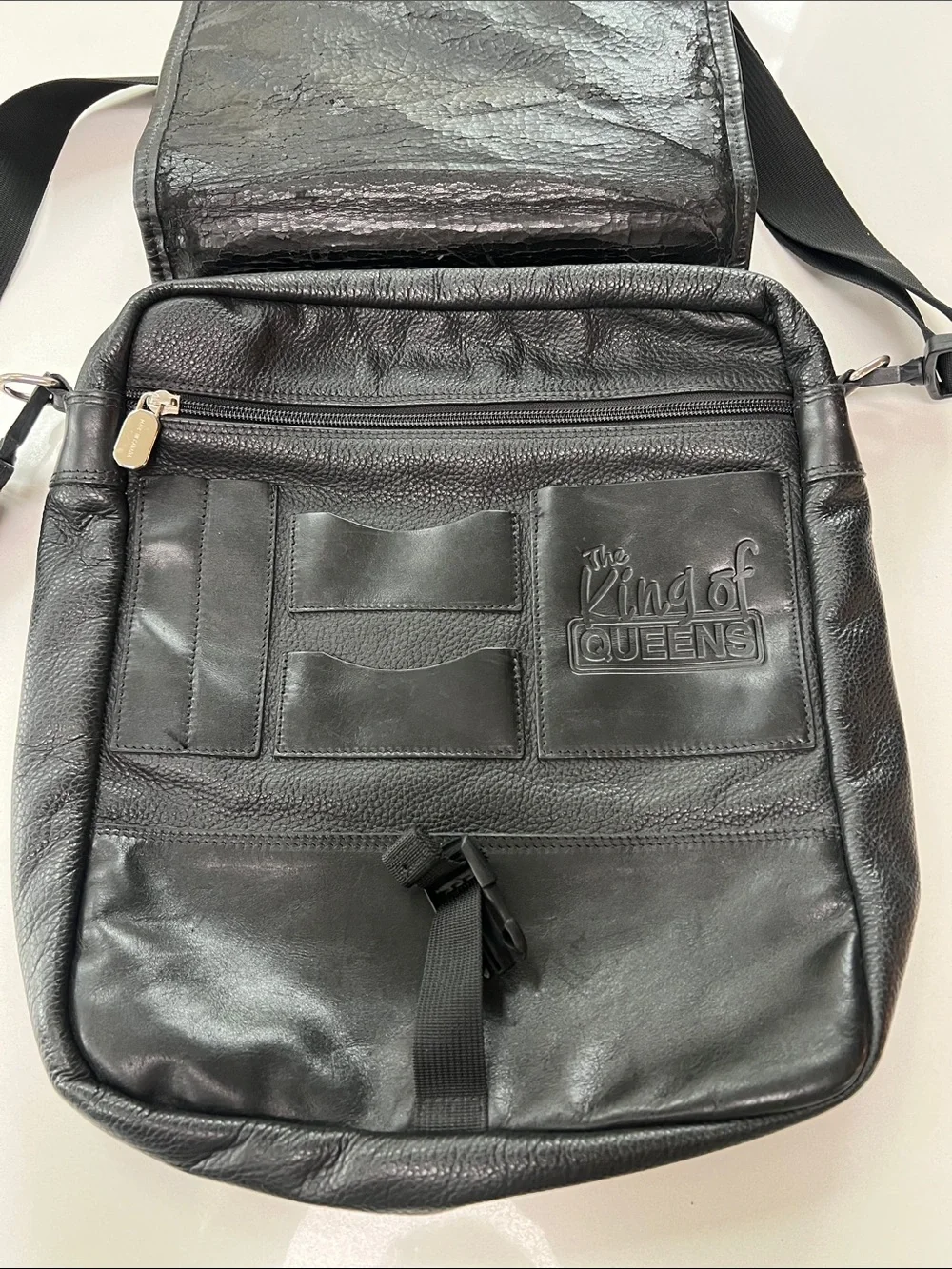 Men's Black Leather Messenger Bag by Roots with Top Handle and Adjustable Strap